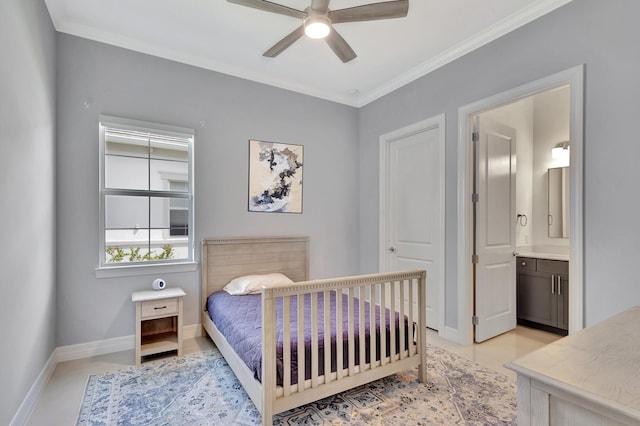 bedroom with crown molding, ensuite bathroom, and ceiling fan