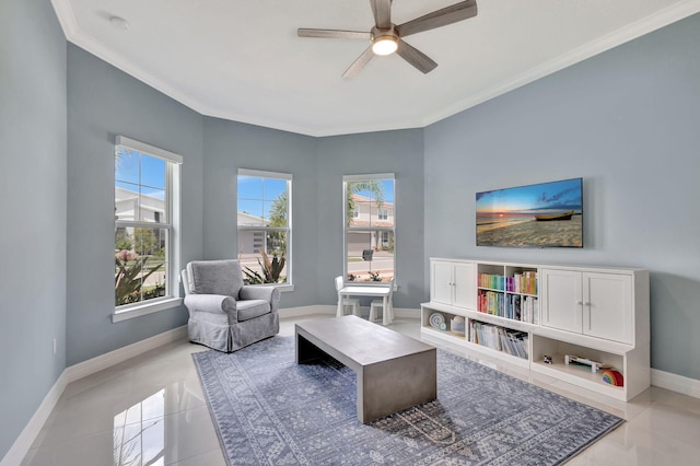 living area featuring ornamental molding, light tile patterned floors, and ceiling fan