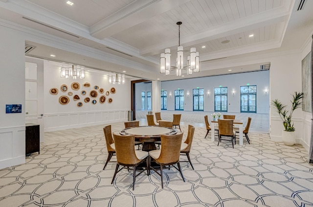 dining area featuring crown molding, a chandelier, and beam ceiling