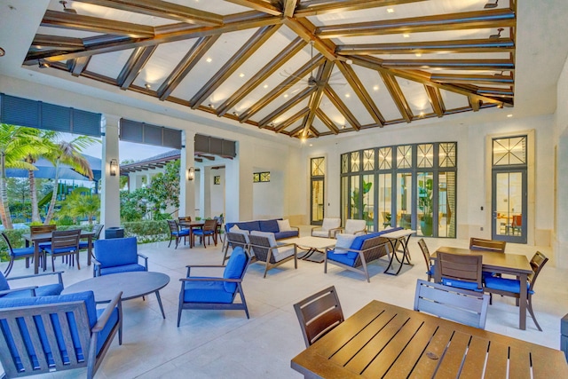 view of patio / terrace featuring lofted ceiling