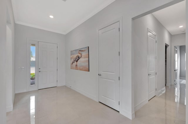 entrance foyer featuring crown molding