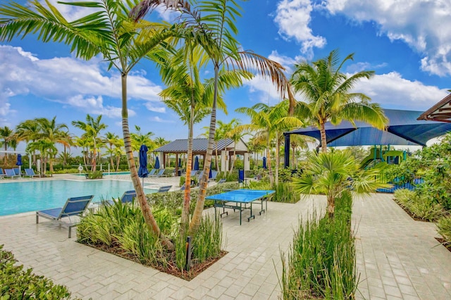 view of swimming pool with a gazebo and a patio area