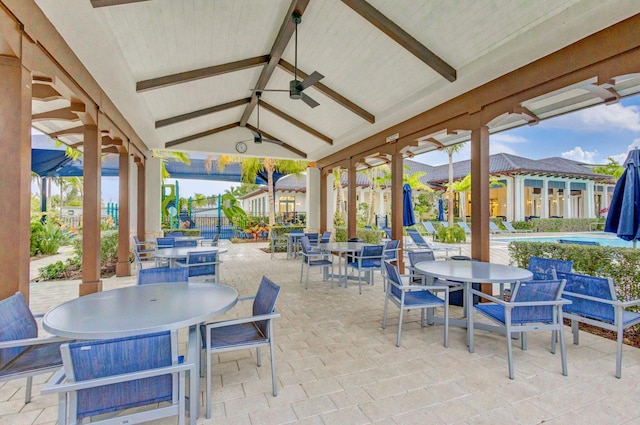 view of patio featuring a swimming pool and ceiling fan