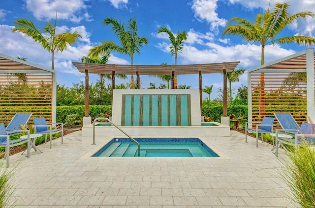 view of pool with a pergola, a patio area, and an in ground hot tub