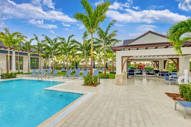 view of swimming pool featuring a gazebo and a patio