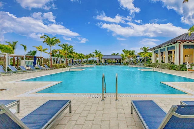 view of pool featuring a patio and pool water feature