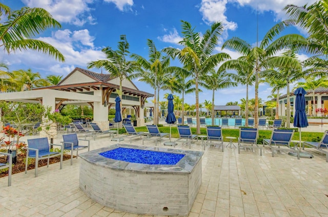 view of patio / terrace featuring a gazebo and an outdoor fire pit