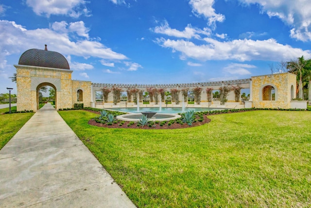 view of community featuring a yard