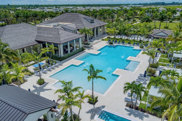 view of swimming pool with a patio