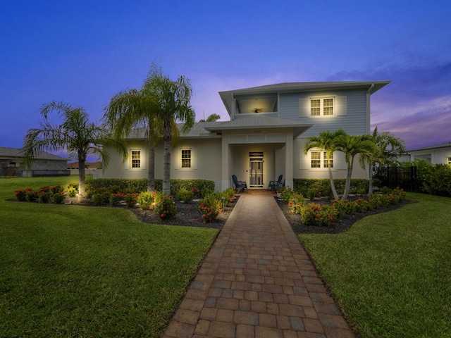 view of front of property with a lawn