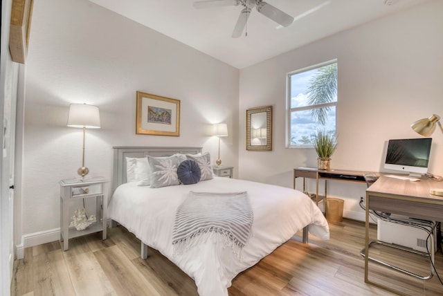 bedroom with light hardwood / wood-style flooring and ceiling fan