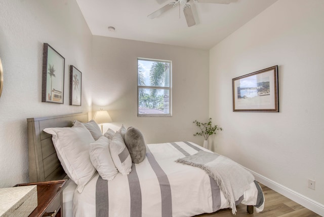 bedroom featuring ceiling fan and light hardwood / wood-style flooring