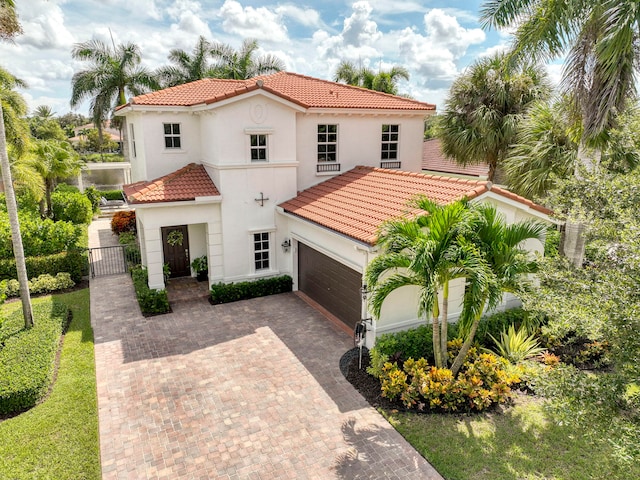 mediterranean / spanish-style home featuring a garage