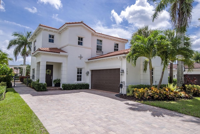 mediterranean / spanish house featuring a garage