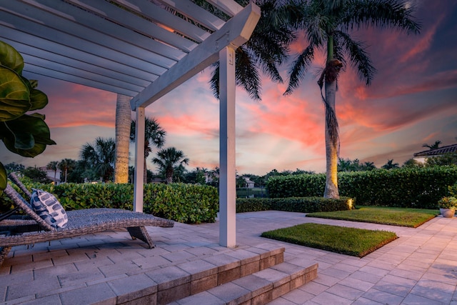 patio terrace at dusk with a pergola