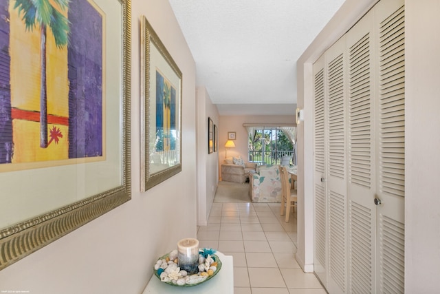 hallway featuring light tile patterned floors