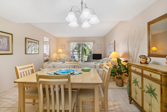 tiled dining space featuring a notable chandelier