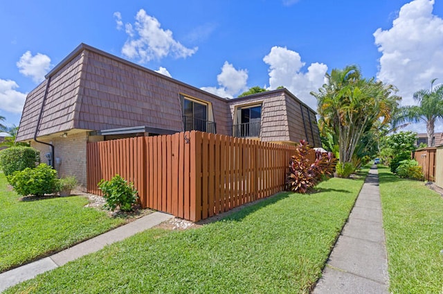 view of home's exterior featuring a lawn