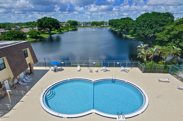 632 Springdale Cir, Palm Springs, FL 33461 - community pool with a water view, fence, and a patio