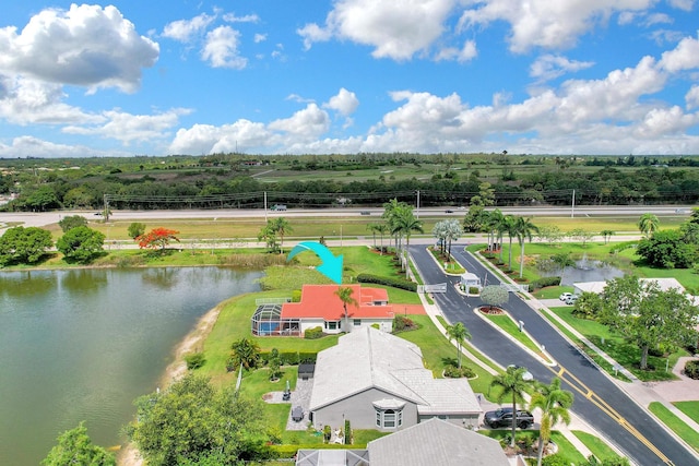 drone / aerial view featuring a water view and a rural view