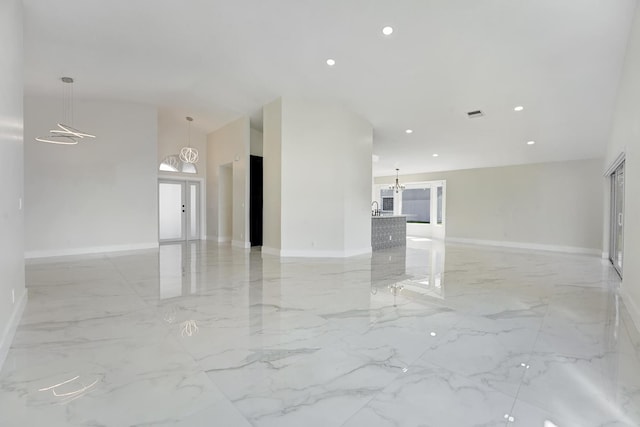 interior space featuring an inviting chandelier and sink