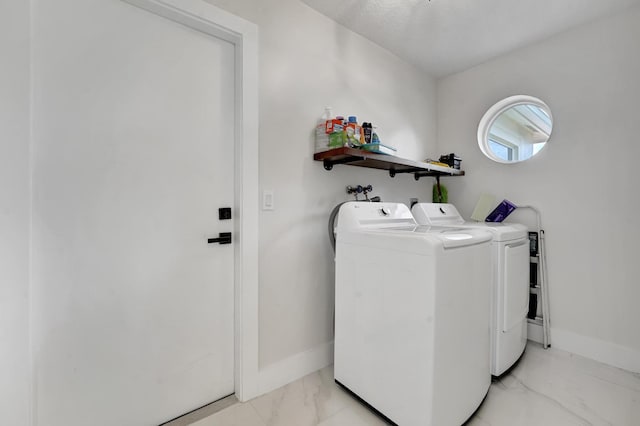 laundry room with separate washer and dryer