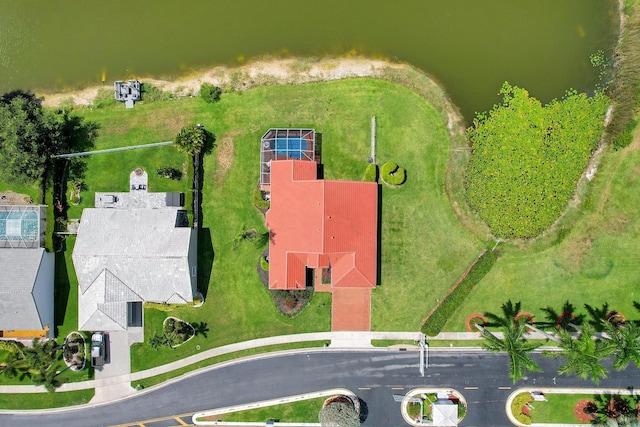 birds eye view of property with a water view