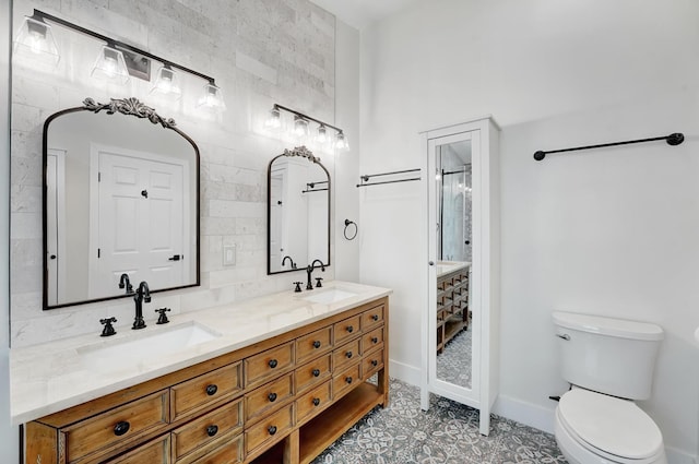 bathroom with vanity, toilet, and a shower with shower door