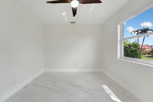 spare room featuring ceiling fan