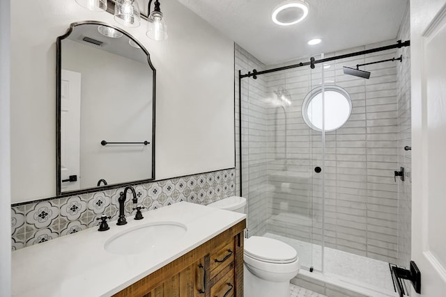 bathroom with an enclosed shower, toilet, and vanity