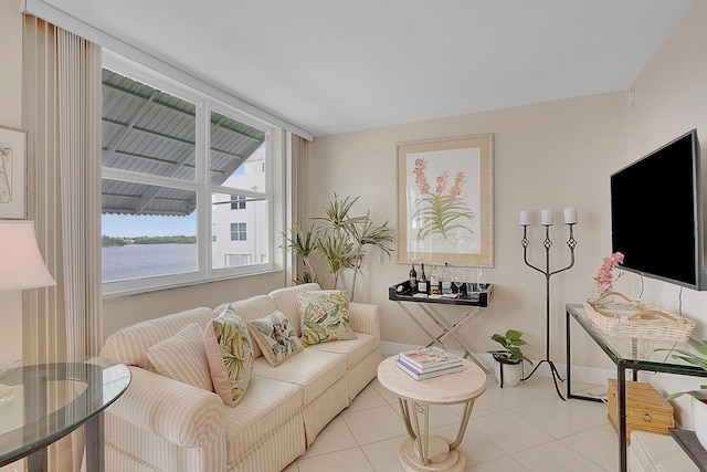 tiled living room with a water view