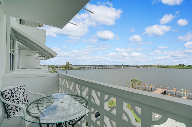 balcony featuring a water view