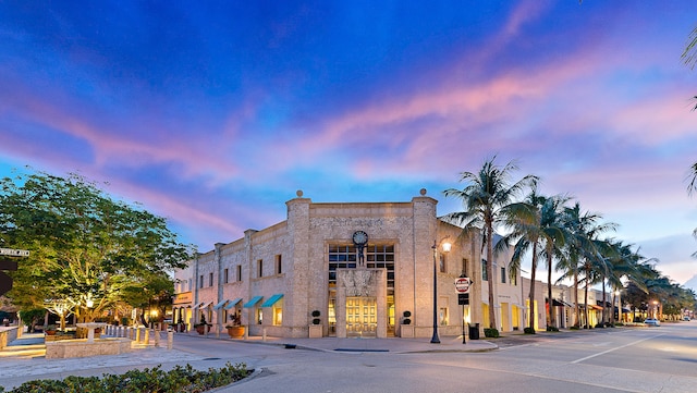 view of outdoor building at dusk