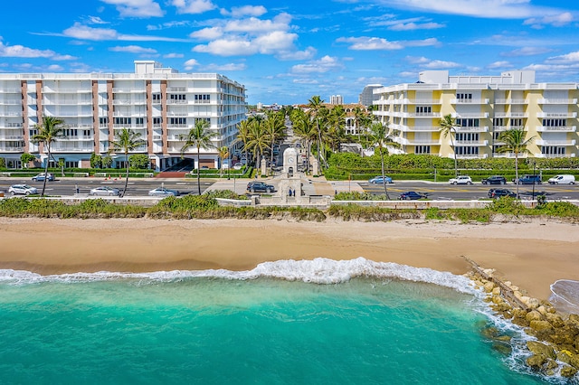 aerial view with a water view and a beach view