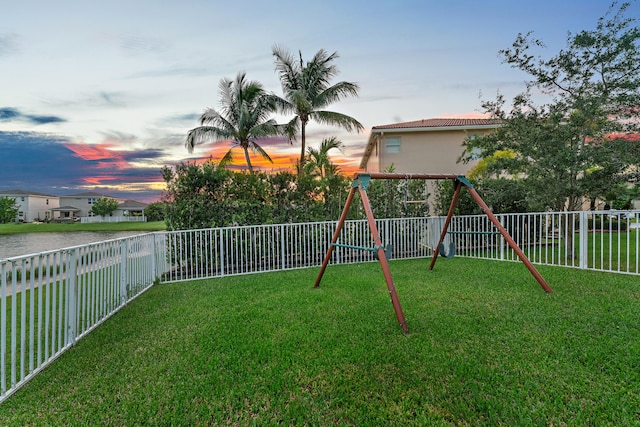 yard at dusk with a playground