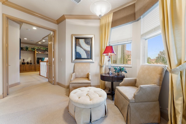 living area featuring crown molding and carpet floors