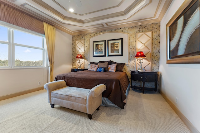 bedroom with crown molding, a raised ceiling, and carpet floors