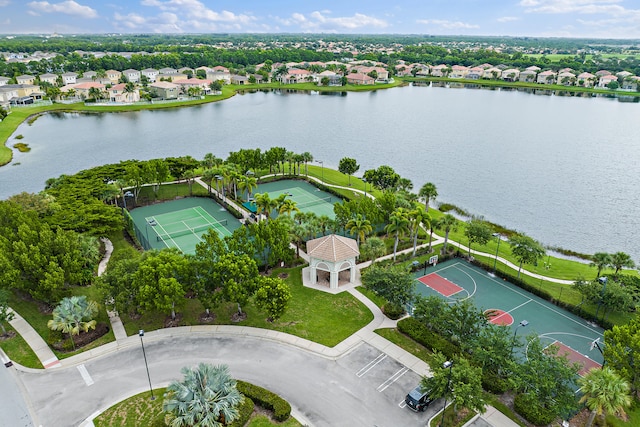 birds eye view of property with a water view