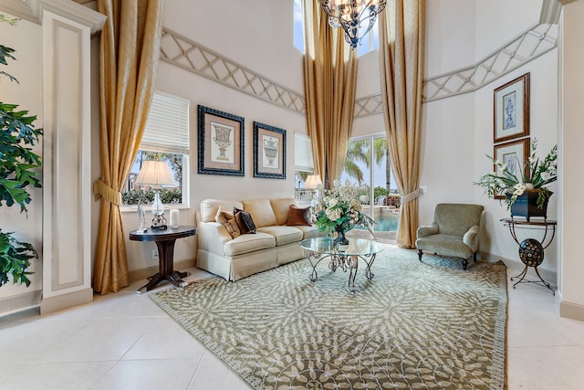 tiled living room with a chandelier