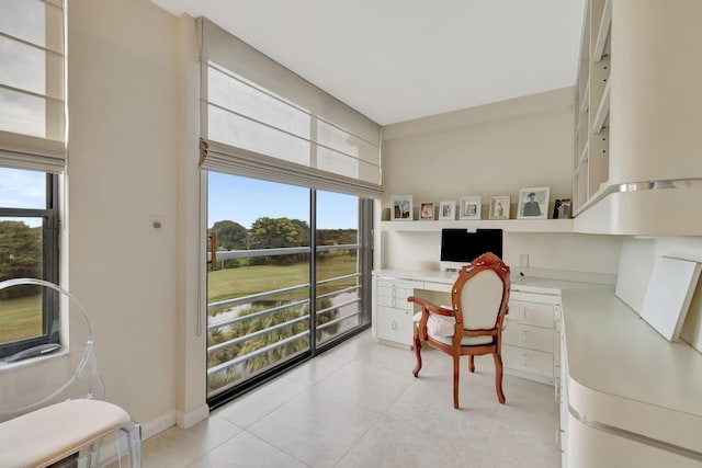 7567 Imperial Dr Unit 601, Boca Raton, FL 33433 - home office featuring built in study area, healthy amount of natural light, and light tile patterned floors