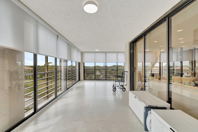 unfurnished sunroom featuring a healthy amount of sunlight