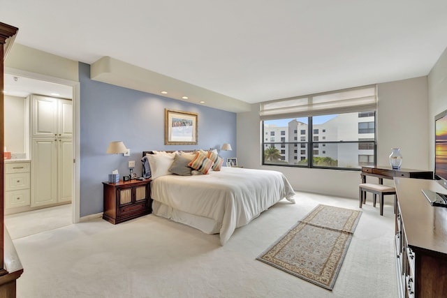 bedroom with light colored carpet