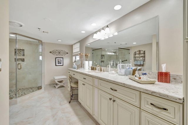 bathroom with toilet, vanity, and a shower with shower door