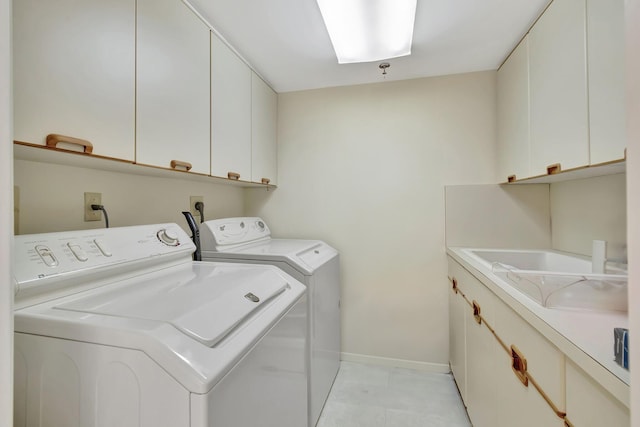 7567 Imperial Dr Unit 601, Boca Raton, FL 33433 - laundry area with cabinet space, washing machine and clothes dryer, and baseboards