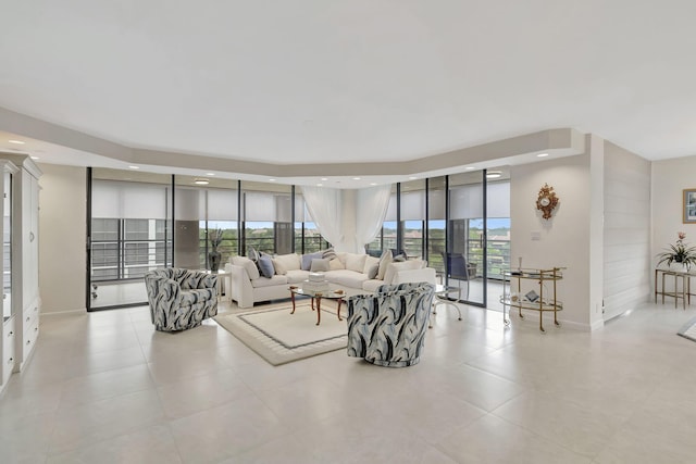 living room featuring floor to ceiling windows