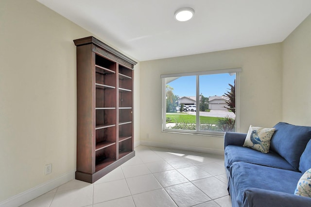 sitting room with light tile patterned floors