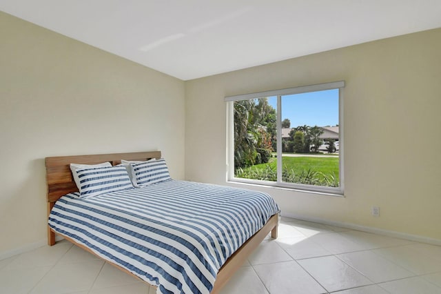 bedroom with light tile patterned flooring