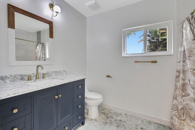 bathroom with vanity, curtained shower, toilet, and tile patterned flooring