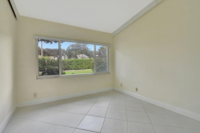 spare room with light tile patterned flooring