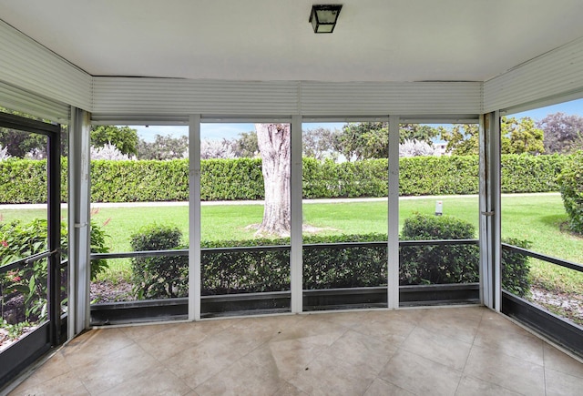 unfurnished sunroom with a wealth of natural light